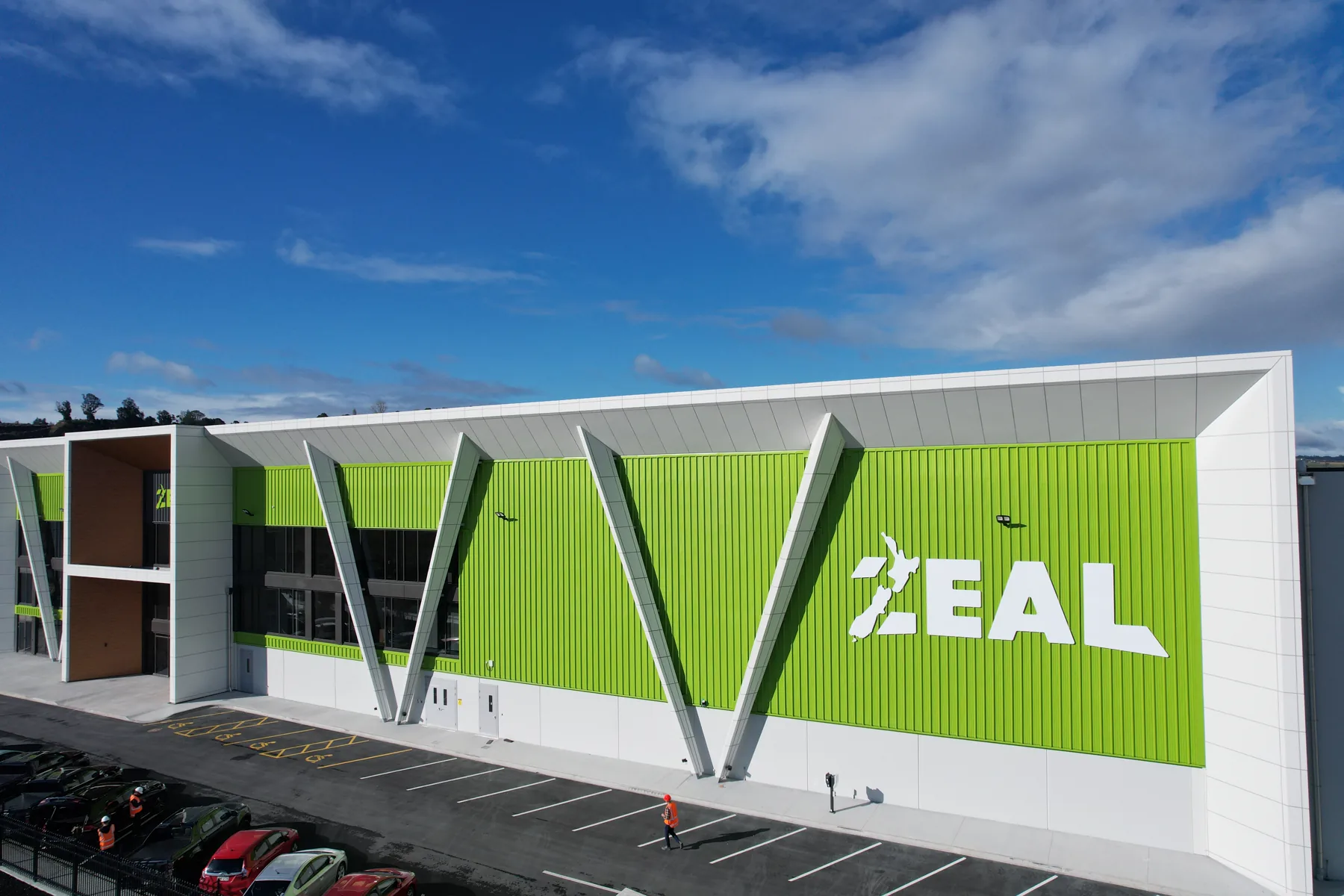 Angled view of the factory's steel-braced facade