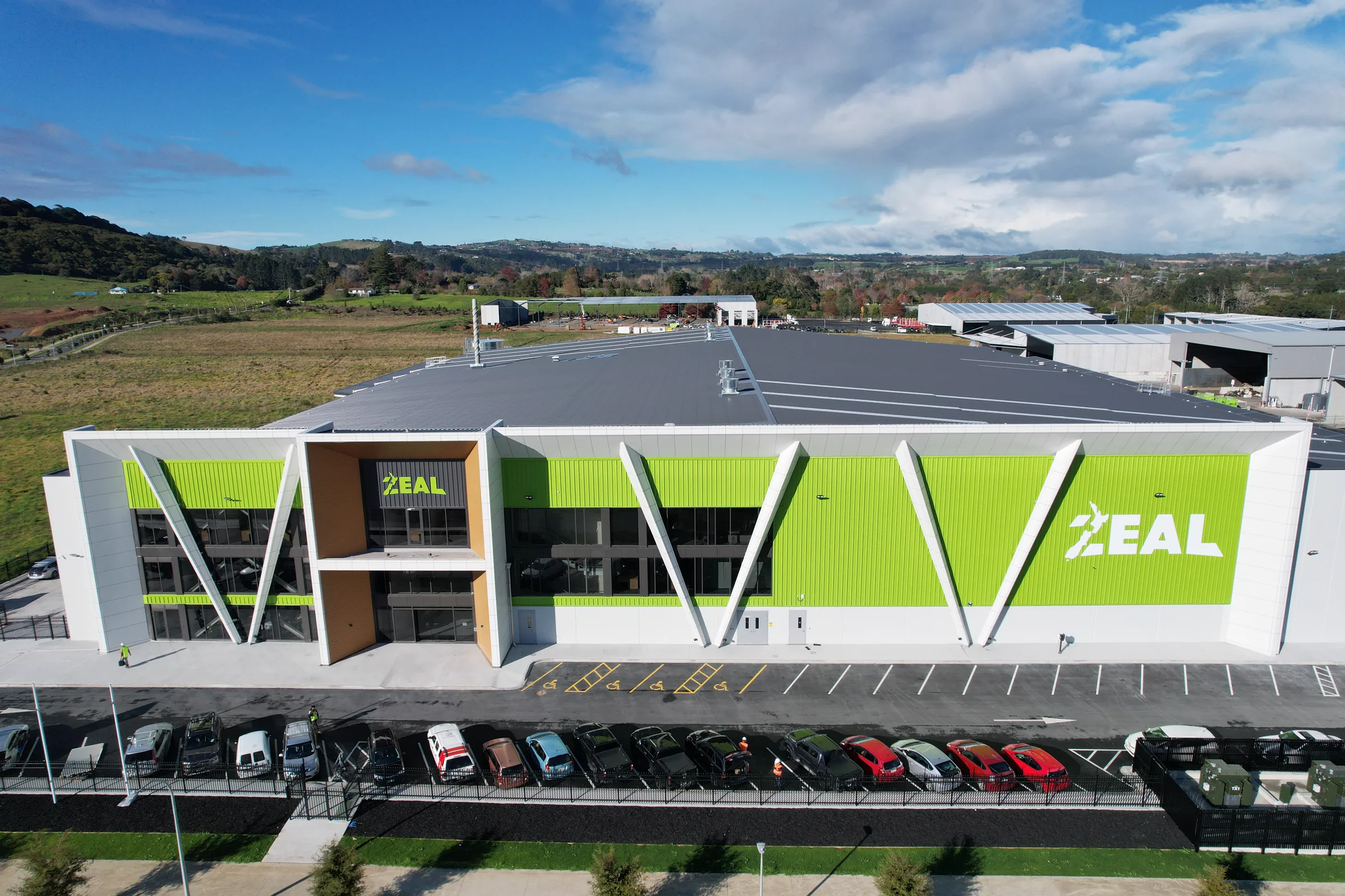 Aerial view of the completed factory's full front elevation