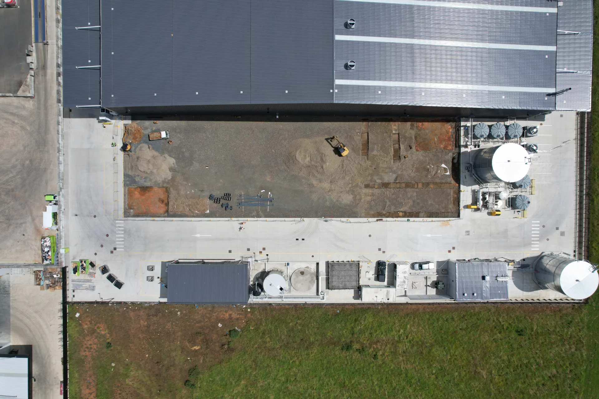 Overhead view of groundworks beside the existing industrial building