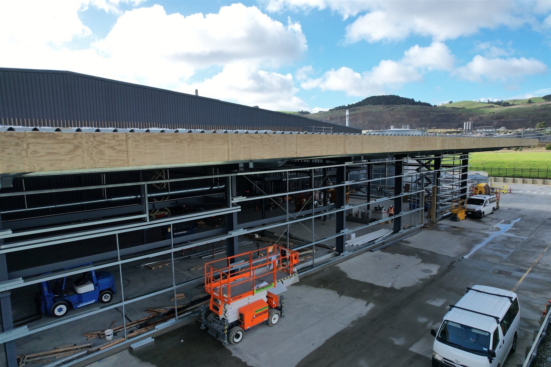 Steel-framed extension under construction at an industrial facility
